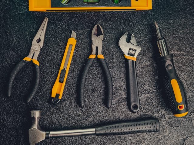 basic-home-repair-tools-on-black-background-2023-11-27-04-59-37-utc