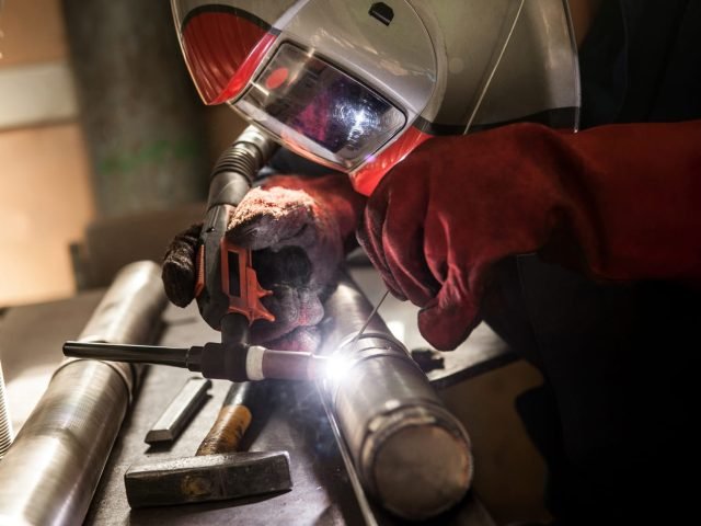 closeup-of-man-wearing-mask-welding-in-a-workshop-2024-01-17-23-58-07-utc